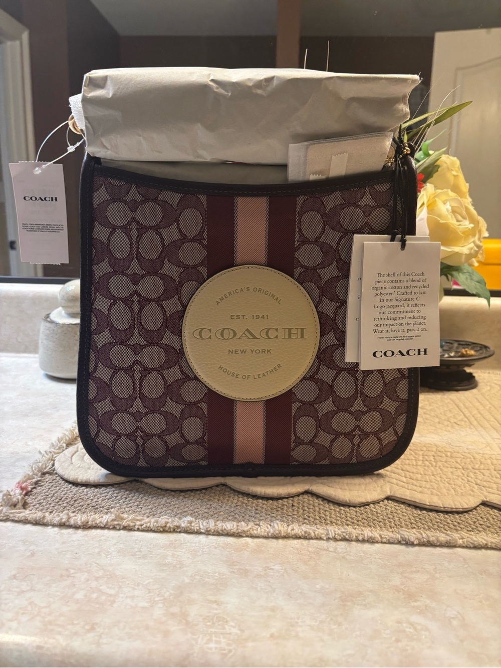 Coach Handbag with Tag and Decorative Flowers